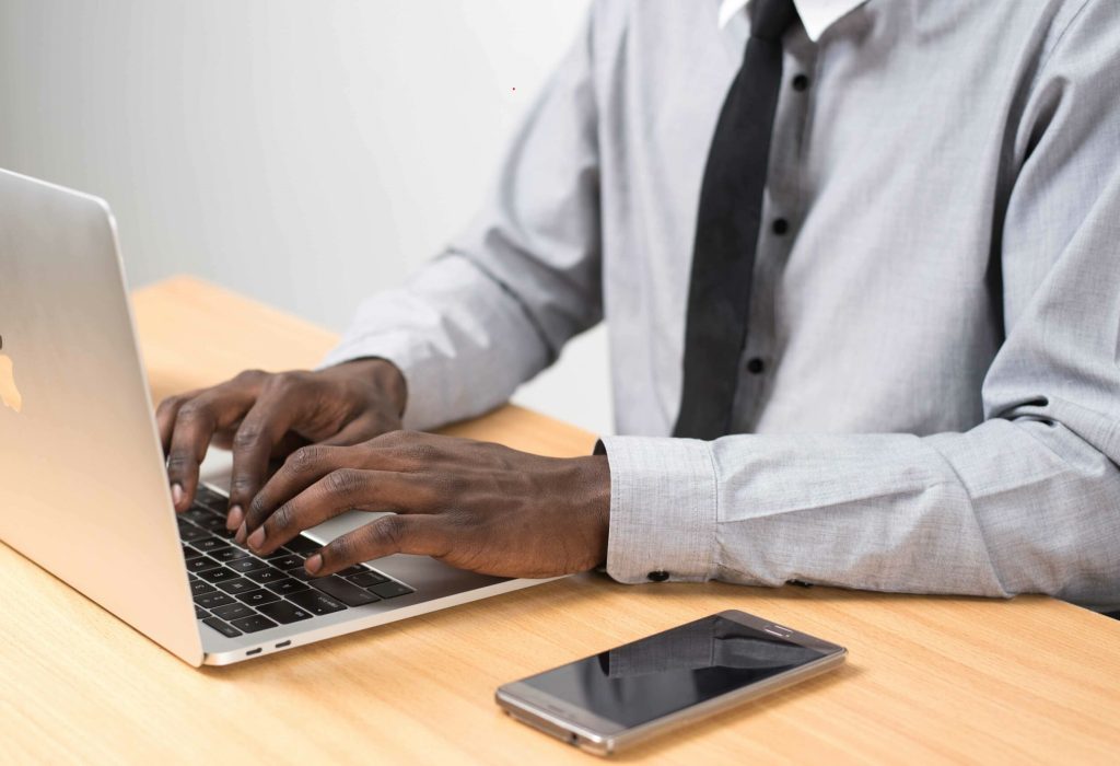 image of black man working at computer