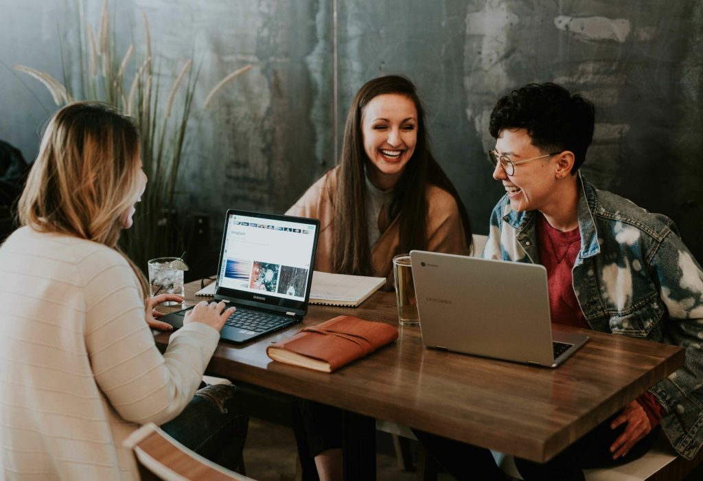 stock image of young people working and laughing
